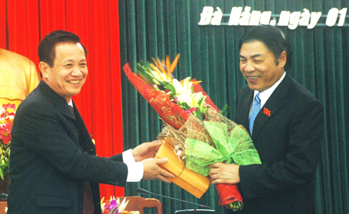 Ông Trần Thọ (trái) và ông Nguyễn Bá Thanh (bên phải)