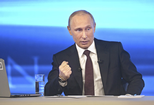 Tổng thống Putin tuyên bố sẽ nỗ lực khôi phục lòng tin với Mỹ - Ảnh: Reuters