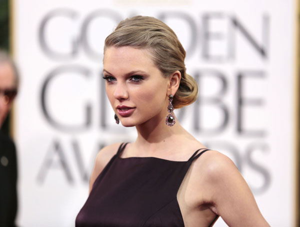Taylor Swift hài lòng với cuộc sống tập trung cho bạn bè, gia đình và sự nghiệp - Ảnh: Reuters