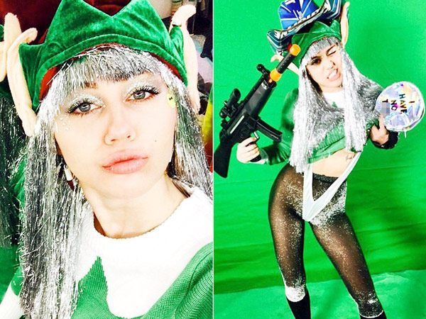 Nữ ca sĩ Miley Cyrus phấn chấn trở lại sau ngày nhập viện và vui mừng đón Giáng sinh với bộ trang phục màu xanh.