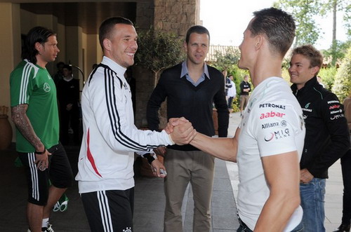 Lukas Podolski và Michael Schumacher