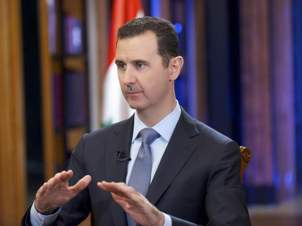 Tổng thống Syria, Bashar al-Assad bác bỏ mọi cuộc đàm phán với các nhóm vũ trang Syria trừ khi các nhóm này buông vũ khí đầu hàng - Ảnh: Reuters