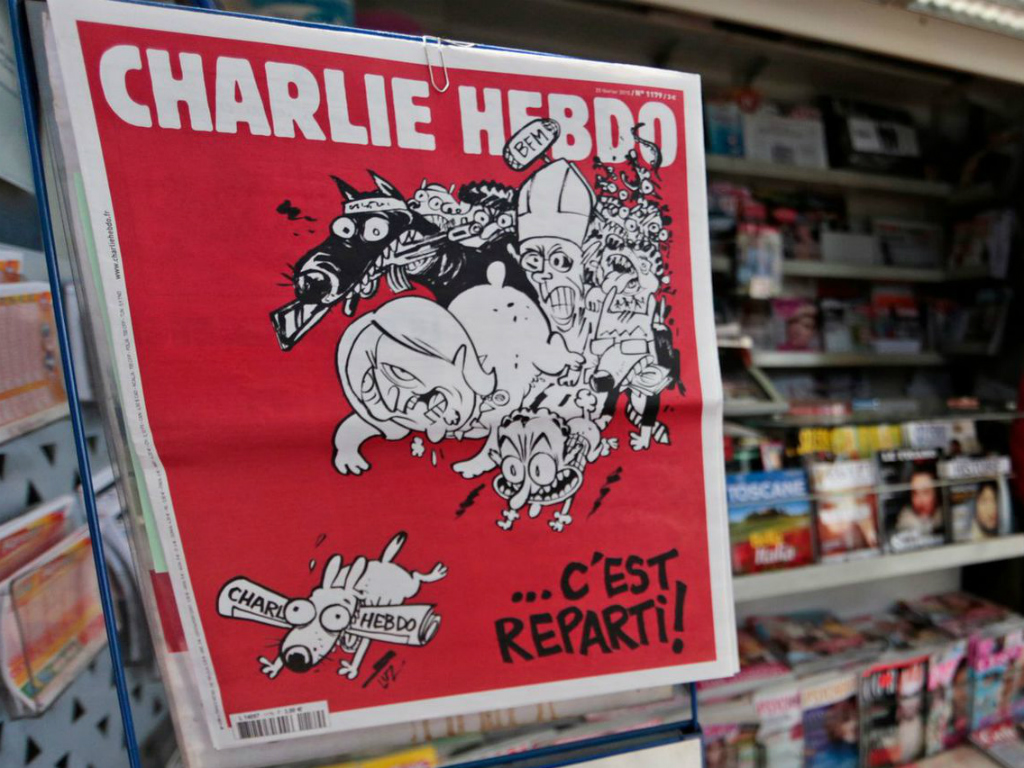 Một ấn bản của tạp chí biếm hoạ Charlie Hebdo - Ảnh: Reuters