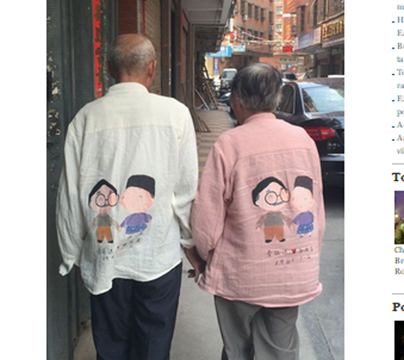 Hình ảnh ông bà cụ mặc áo đôi dạo phố gây sốt cộng đồng mạng - Ảnh chụp màn hình en.people.cn