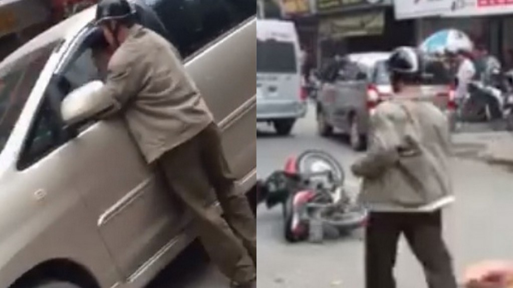 Người đàn ông bị xe điên đâm cố đuổi theo để bắt tài xế dừng xe lại - Ảnh chụp từ clip