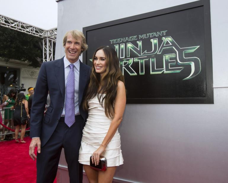Nữ chính Megan Fox và nhà sản xuất Michael Bay trong lễ ra mắt “Teenage Mutant Ninja Turtles” phần 1 tại Los Angeles, California, Mỹ, tháng 8.2014 - Ảnh: Reuters