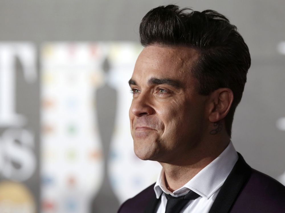 Robbie Williams tại lễ trao giải âm nhạc BRIT Awards, London, Anh, tháng 2.2013 - Ảnh: Reuters