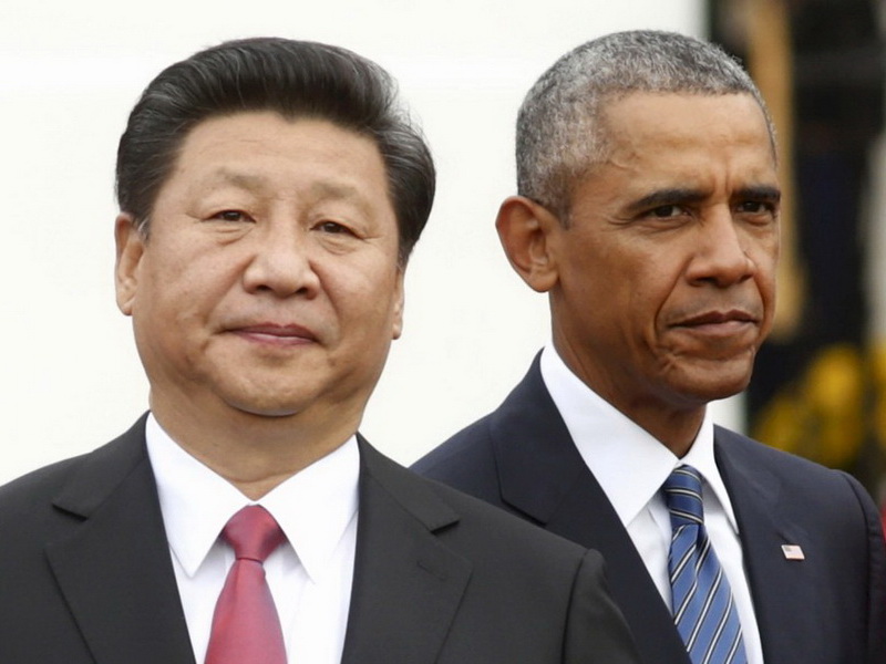 Tổng thống Mỹ Barack Obama (phải) đứng cạnh Chủ tịch Trung Quốc Tập Cận Bình nhân chuyến thăm Mỹ của ông Tập hồi tháng 9 - Ảnh: Reuters