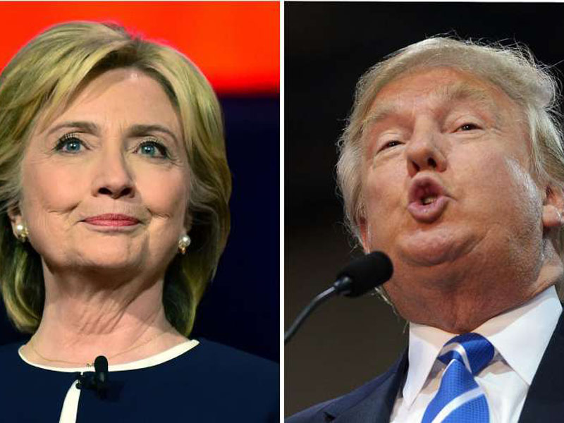 Bà Hillary Clinton (trái) và ông Donald Trump đang chĩa mũi dùi vào nhau - Ảnh: AFP