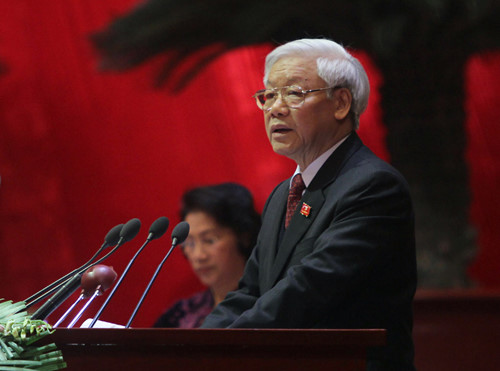 Tổng bí thư Nguyễn Phú Trọng trình bày báo cáo của BCH T.Ư khóa XI tại phiên khai Đại hội sáng nay - Ảnh: L.Q.Phổ