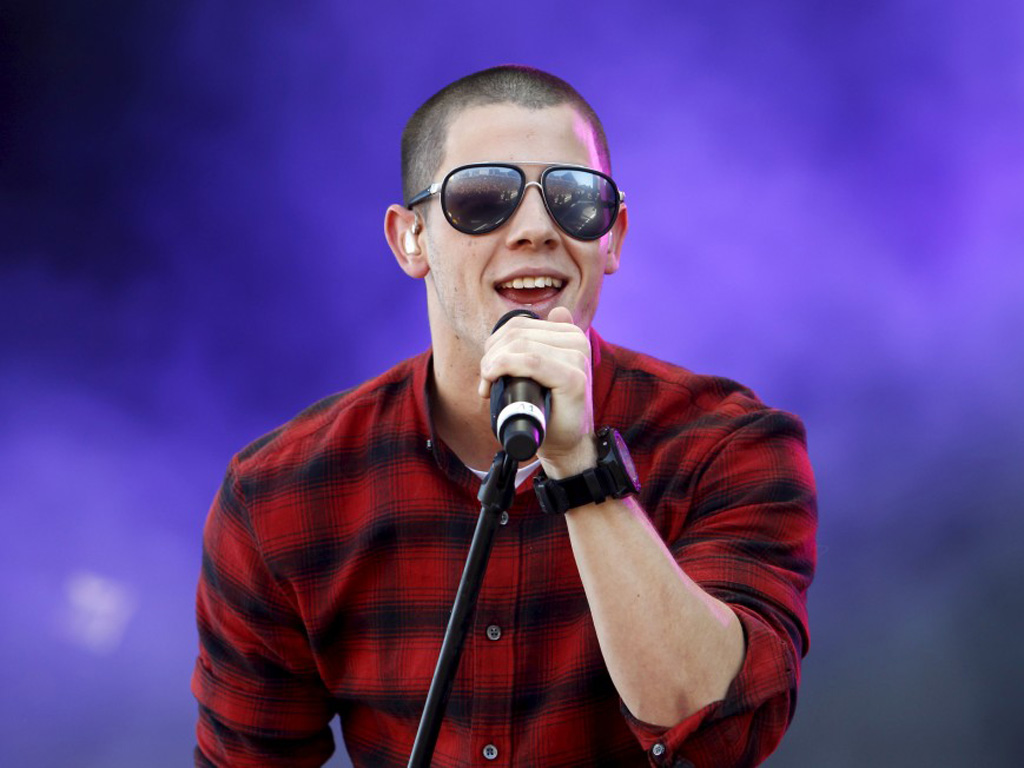 Nick Jonas biểu diễn trong lễ hội âm nhạc ngoài trời iHeartRadio tại Las Vegas, Mỹ năm 2015 - Ảnh: Reuters