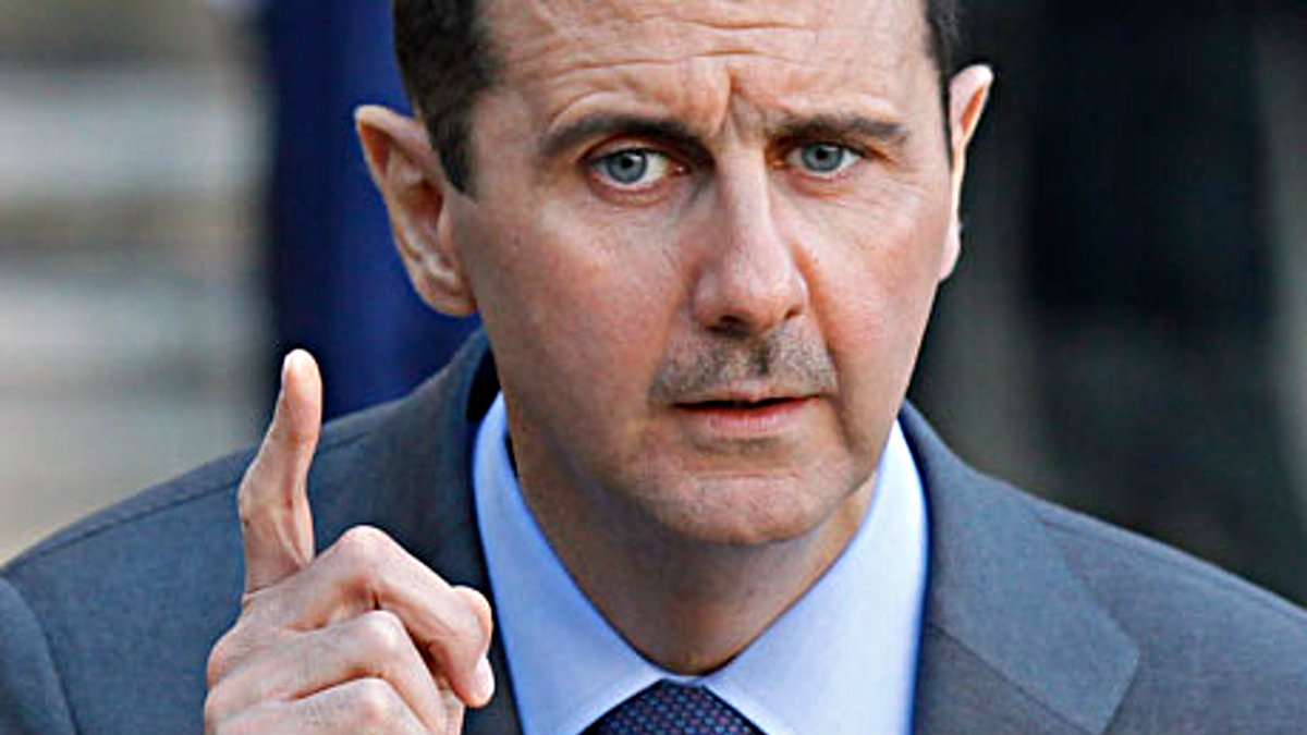 Tổng thống Syria Bashar al-Assad đồng ý tổ chức bầu cử sớm - Ảnh: Reuters
