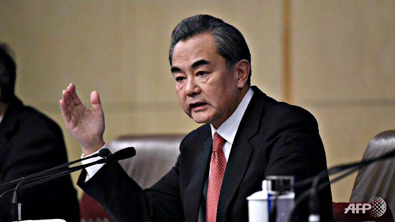 Ngoại trưởng Vương Nghị nói Trung Quốc không muốn thay thế hay giống nước Mỹ - Ảnh: AFP