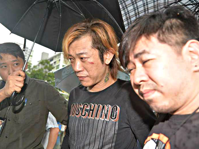 Jackson Lim Hou Peng (giữa) bị 4,5 năm tù vì tội ngộ sát với bạn gái người Việt - Ảnh: The New Paper