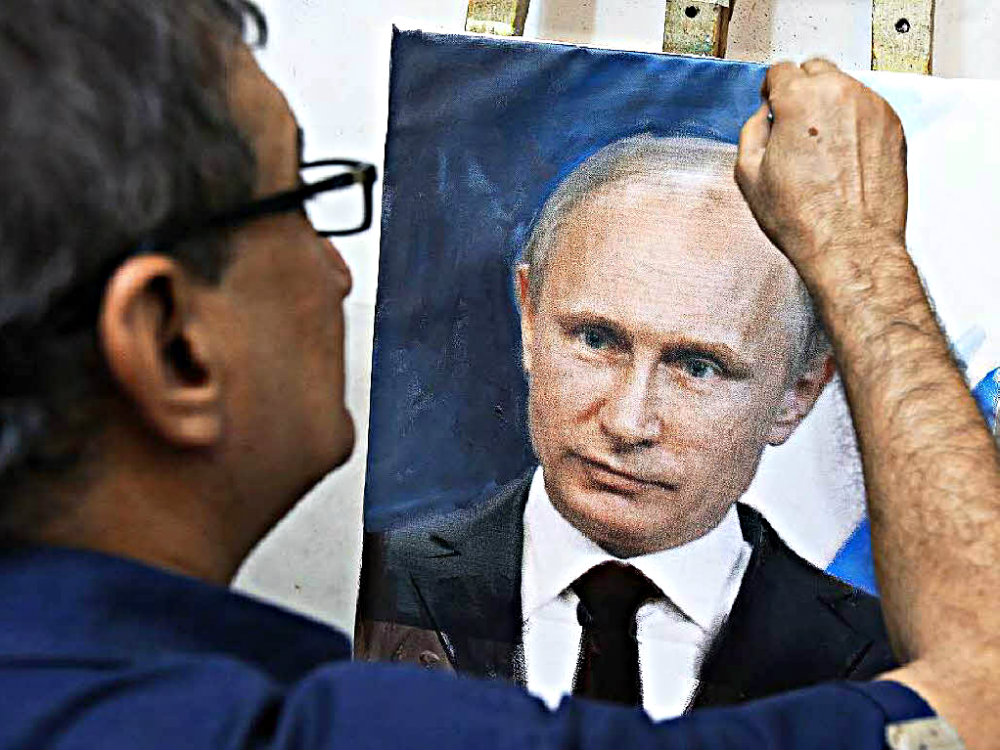 Nga cáo buộc truyền thông một số nước đang chuẩn bị chiến dịch tấn công bôi nhọ ông Putin - Ảnh: AFP