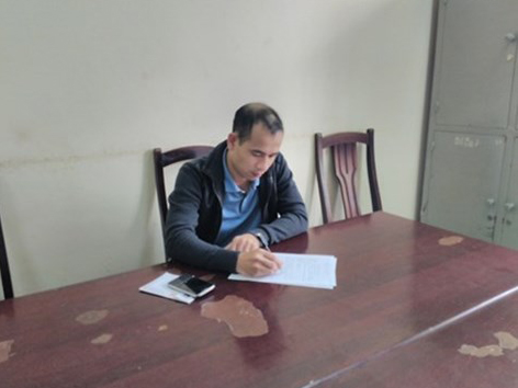 Trần Quang Tuấn tại trụ sở công an - Ảnh: Hà An
