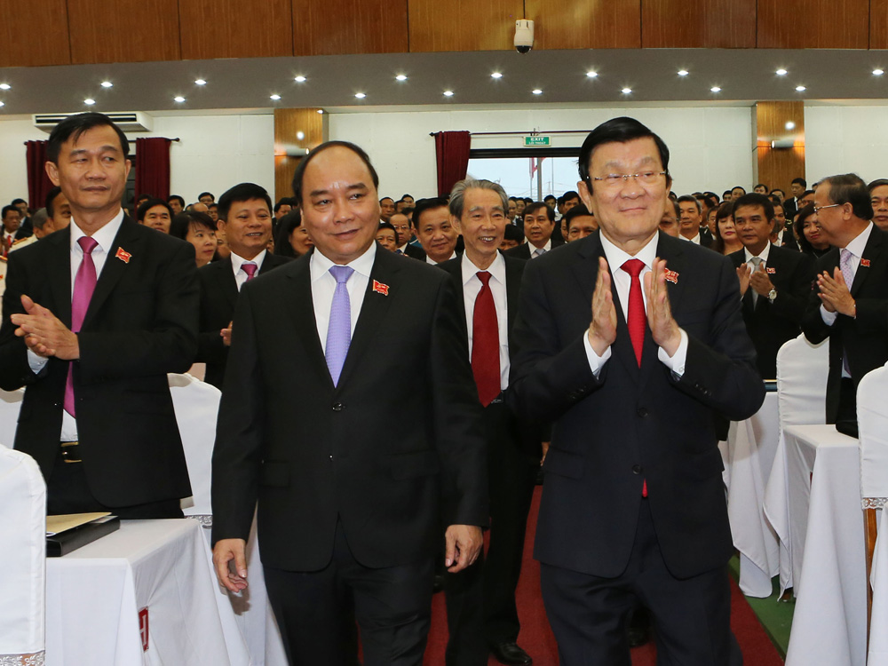 Chủ tịch nước Trương Tấn Sang (phải) và Phó thủ tướng Nguyễn Xuân Phúc đến dự đại hội - Ảnh: TTXVN