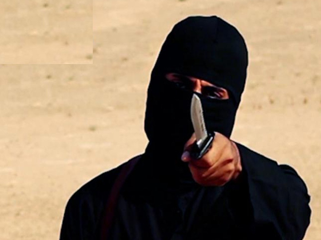 Tên đao phủ khét tiếng trong các video hành quyết của IS là một kẻ bệnh hoạn - Ảnh: Reuters