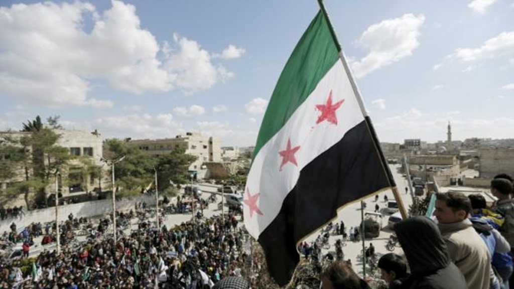 Lá cờ của Quân đội giải phóng Syria. Đất nước này tiếp tục đối diện nguy cơ bế tắc về đàm phán hòa bình, trong bối cảnh người Kurd có ý định ly khai - Ảnh: Reuters