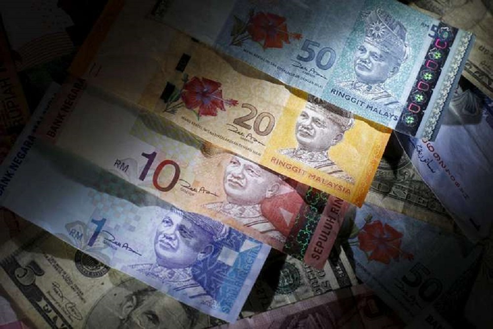 Tiền tệ các nước mới nổi lại sụt giá vì tình hình kinh tế Mỹ và Trung Quốc - Ảnh: Reuters