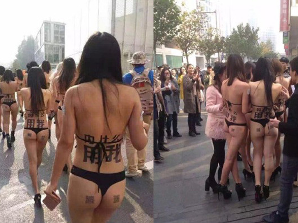 Những cô gái mát mẻ trên phố ngày 3.11 - Ảnh: Shanghaiist