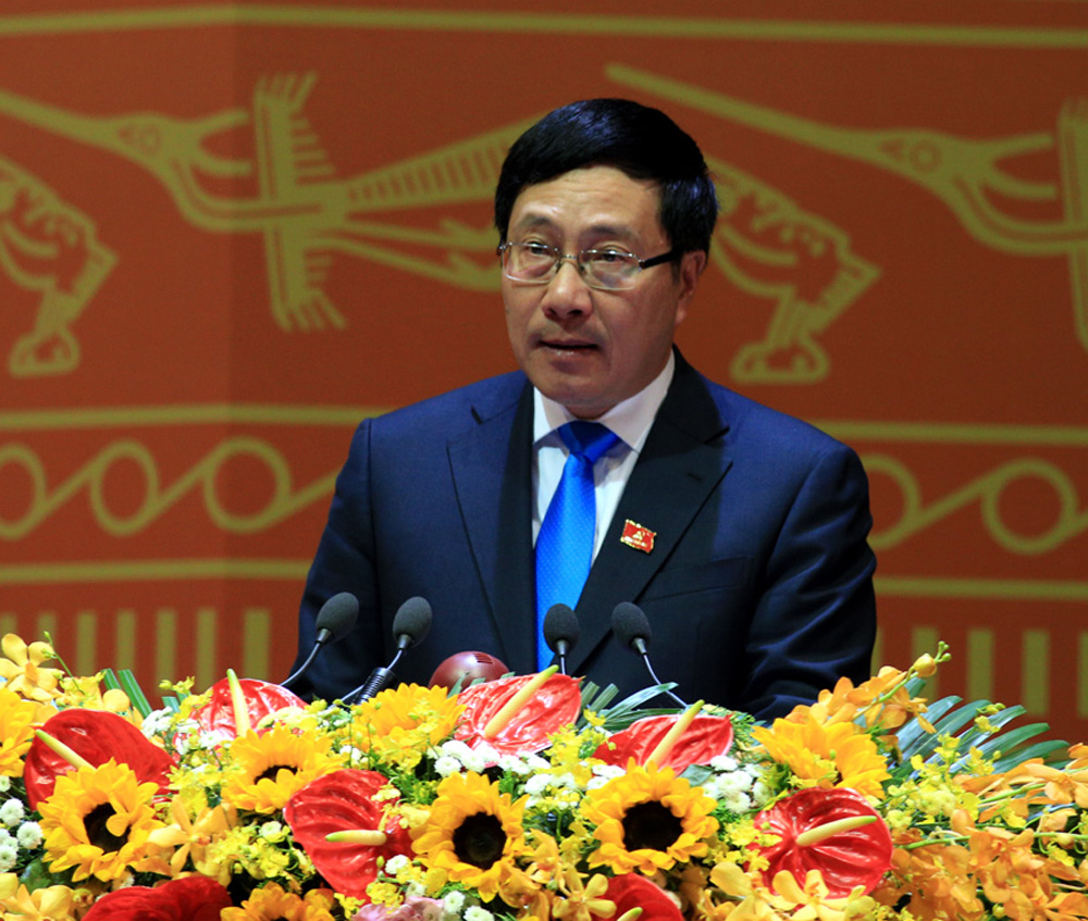 Phó thủ tướng, Bộ trưởng Bộ Ngoại giao Phạm Bình Minh trình bày tham luận tại Đại hội XII, sáng 23.1 - Ảnh: L.Q.P