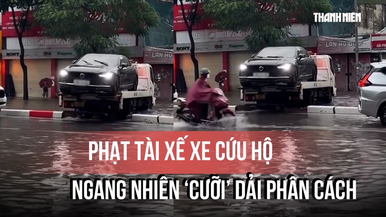 Xe cứu hộ 'cưỡi' dải phân cách giữa phố ngập bị CSGT phạt 5 triệu