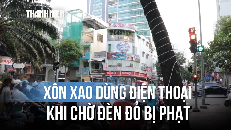 Xôn xao dùng điện thoại khi chờ đèn đỏ bị phạt, Cục CSGT nói gì?