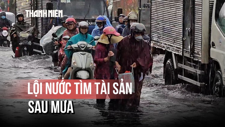 Quốc lộ 50 hóa sông sau cơn mưa, người dân bì bõm tìm tài sản