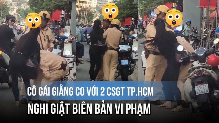 Cô gái giằng co với 2 CSGT TP.HCM, nghi giật biên bản vi phạm
