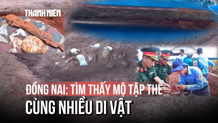 Cận cảnh chiếc bút khắc hình chim bồ câu và 2 chữ 'Tiến Quy' dưới mộ tập thể