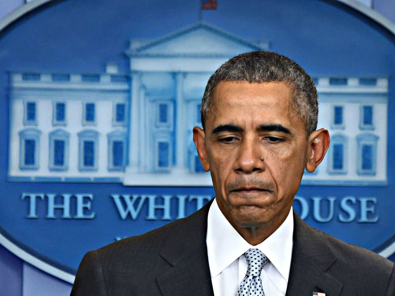 Tổng thống Mỹ Barack Obama chết lặng khi nghe tin khủng bố ở Paris - Ảnh: AFP