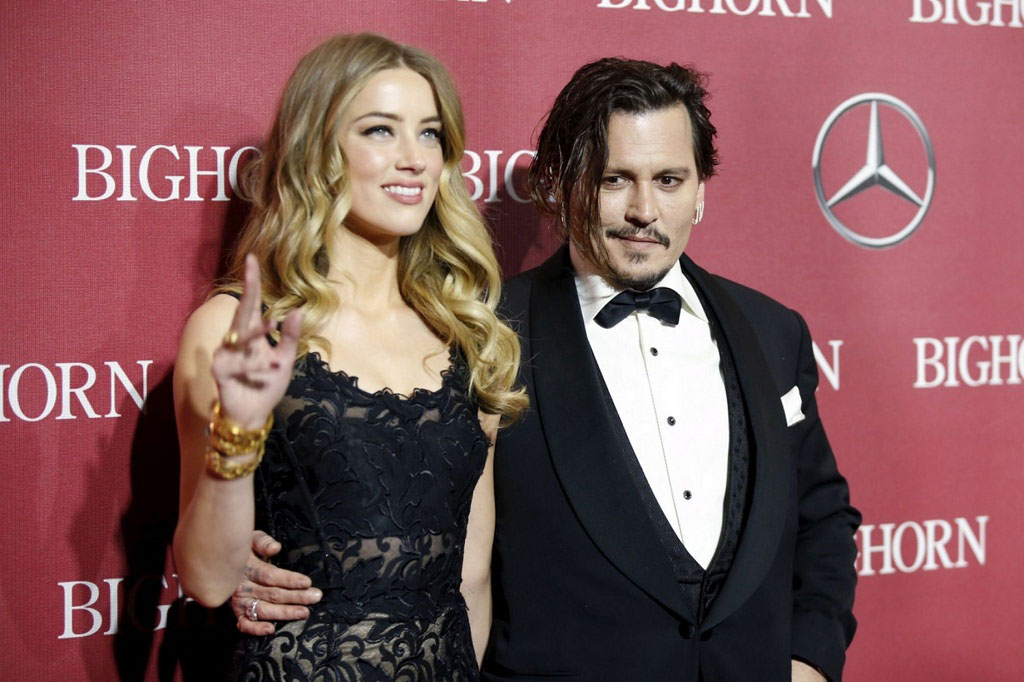 Amber Heard có vẻ như đã tìm được niềm vui sau khi cuộc ly hôn với Johnny Depp kết thúc êm thấm - Ảnh: Reuters
