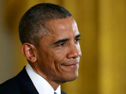  Ông Obama khép lại năm 2014 với tâm thế tự tin - Ảnh: Reuters