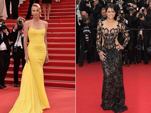 Từ trái qua, Charlize Theron và Michelle Rodriguez xinh đẹp trên thảm đỏ Cannes ngày 2 - Ảnh AFP