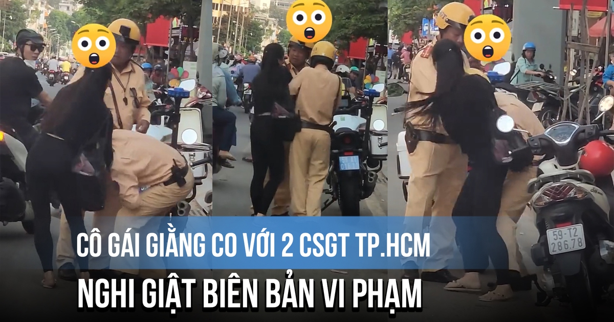 Cô gái giằng co với 2 CSGT TP.HCM, nghi giật biên bản vi phạm