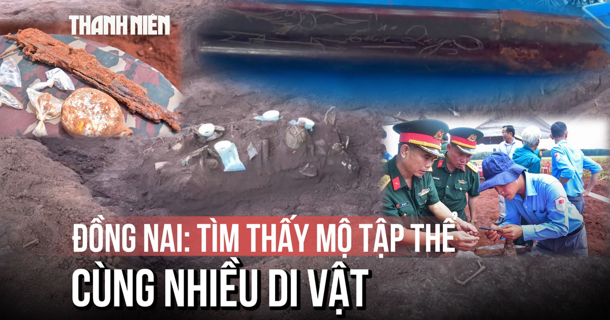 Cận cảnh chiếc bút khắc hình chim bồ câu và 2 chữ 'Tiến Quy' dưới mộ tập thể