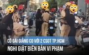 Cô gái giằng co với 2 CSGT TP.HCM, nghi giật biên bản vi phạm