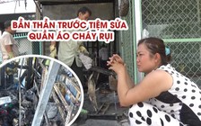 Người phụ nữ bần thần trước tiệm sửa quần áo cháy rụi