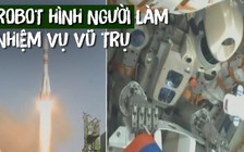 Robot hình người nắm chặt cờ Nga trên đường lên vũ trụ