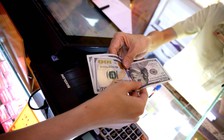 Giá vàng, USD giảm sau tin Fed tăng lãi suất