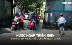 Nước ngập triền miên ở hẻm TP.HCM: Shipper lội nước, trẻ con xắn quần đi học