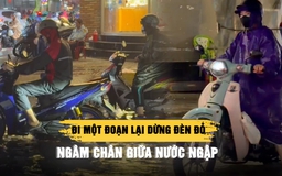 Mưa lớn giờ cao điểm ở TP.HCM: Đi một đoạn lại dừng đèn đỏ, ngâm chân giữa nước ngập