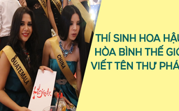 Thí sinh Hoa hậu Hòa bình Thế giới thích thú viết tên bằng thư pháp