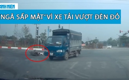 Xe máy phanh gấp, ngã ‘sấp mặt’ vì xe tải vượt đèn đỏ