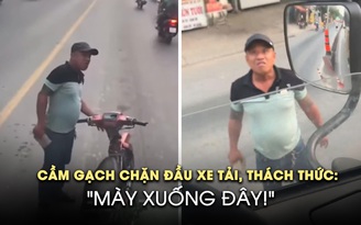 Cầm gạch chặn đầu xe tải, thách thức tài xế đánh nhau