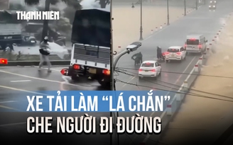 Hành động đẹp giữa bão số 10: Xe tải làm 'lá chắn' che chở người đi đường