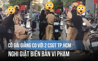 Cô gái giằng co với 2 CSGT TP.HCM, nghi giật biên bản vi phạm