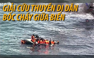 Gay cấn giải cứu thuyền di dân bốc cháy trên biển Tây Ban Nha Gay cấn giải cứu thuyền di dân bốc cháy trên biển Tây Ban Nha
