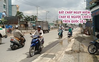 Bất chấp nguy hiểm, nhiều người chạy xe ngược chiều trên quốc lộ 13